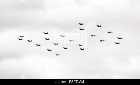 RAF Typhoons fly over the Queen Elizabeth  Olympic Park in a 100 formation, as part of the Centenary Celebrations Stock Photo