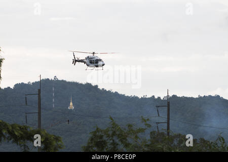 Chiang Rai, Thailand. 10th July, 2018. Rescued schoolboys are moved from a Royal Thai Police helicopter to an awaiting ambulance at a military airport in Chiang Rai. All 12 boys and their football coach have been successfully rescued from a cave in northern Thailand after more than two weeks trapped underground. Credit: Adryel Talamantes/ZUMA Wire/Alamy Live News Stock Photo