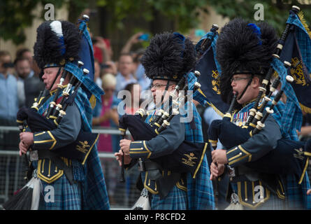 The Mall, London, UK. 10 July, 2018. Celebrations to mark the Centenary of the Royal Air Force take place in London with thousands watching the parade as RAF Waddington Pipe Band march onto The Mall. Credit: Malcolm Park/Alamy Live News. Stock Photo