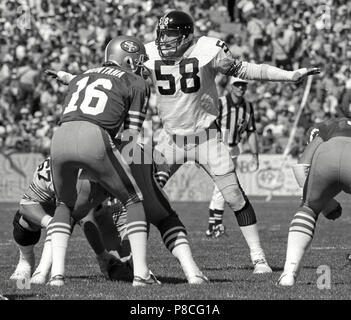 Los Angeles Rams running back Wendell Tyler (26) is thrown for four-yard  loss by Pittsburgh Steelers linebacker Jack Lambert (58) during first  quarter of Super Bowl XIV at the Rose Bowl, Jan.