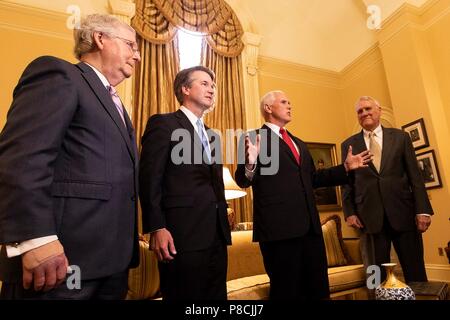Washington, US. 10th July 2018. U.S Vice President Mike Pence, 2nd right, speaks to the media as he introduces Supreme Court nominee Brett Kavanaugh, 2nd left, to Senate Majority Leader Mitch McConnell, left, July 10, 2018 in Washington, DC. Former Sen. Jon Kyl of Arizona looks on from the right. Credit: Planetpix/Alamy Live News Stock Photo