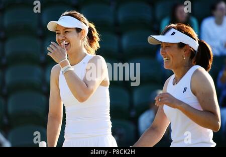 Li Na (L) of China and Ai Sugiyama of Japan react during the ladies' invitation doubles third round match against Tracy Austin of the United States and Anne Keothavong of Britain at the Wimbledon Championships 2018 in London, Britain, on July 10, 2018. Li Na and Ai Sugiyama won 2-0. (Xinhua/Guo Qiuda) Stock Photo