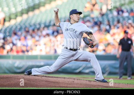 Masahiro Tanaka of the New York Yankees pitches against the Baltimore ...