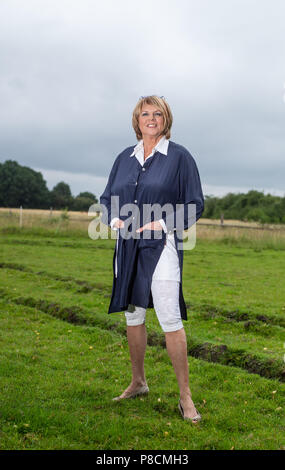 Buechten, Germany. 25th June, 2018. The presenter Alida Gundlach stands on a field. Gundlach celebrates her 75th birthday on 17 July. Credit: Philipp Schulze/dpa/Alamy Live News Stock Photo