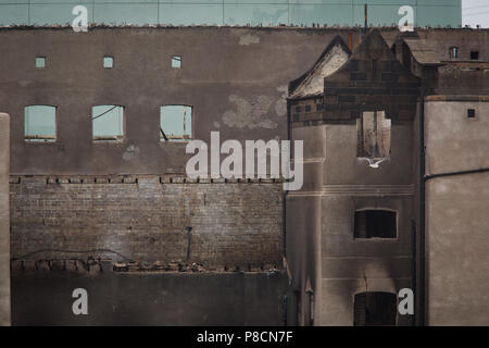 Glasgow, Scotland, on 10 July 2018. Dismantling work begins on the south facade of the devastated, Charles Rennie Mackintosh-designed, Glasgow School of Art. It has been announced that the renowned building, which was destroyed in a second ferocious fire last month after an intial fire in 2014, will be rebuilt, faithful to the original design. Image Credit: Jeremy Sutton-Hibbert/Alamy Live News. Stock Photo