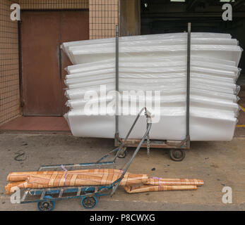 Construction Material at Cart in Front of Hardware Store Stock Photo