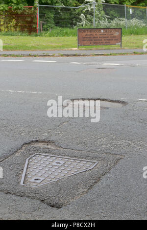 Pot holes in Carterton, Oxfordshire UK. 13th May 2018. UK Weather: Pot holes in West Oxfordshire, multiple potholes on the streets of Oxfordshire. Stock Photo