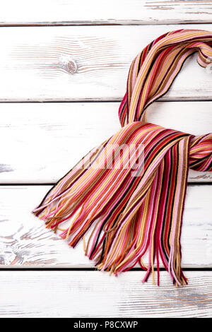 Knitted twisted scarf. Stock Photo