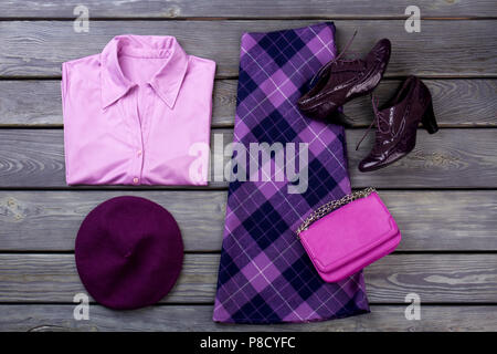 Flat lay set of purple women's clothing. Stock Photo