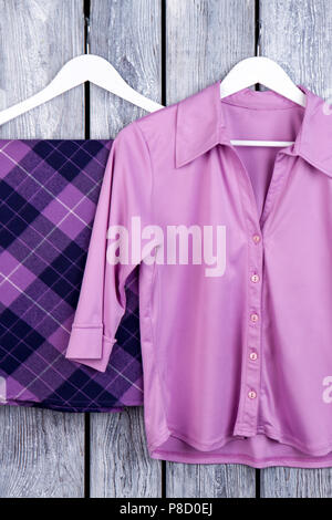 Purple clothes set, flat lay. Stock Photo