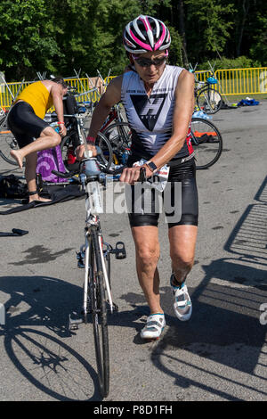 Mary Denitto competiting in the bike segment in the 2018 Stissing Triathlon Stock Photo