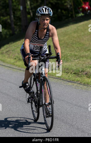 Mary Sheehan competiting in the bike segment in the 2018 Stissing Triathlon Stock Photo