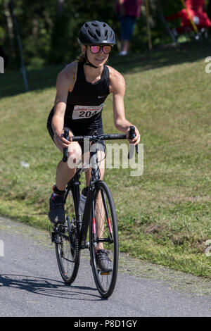 Mariola Moeyaert competiting in the bike segment in the 2018 Stissing Triathlon Stock Photo
