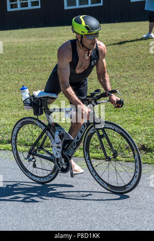 Male competitor in the bike segment in the 2018 Stissing Triathlon Stock Photo