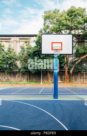 Basketball court in park Stock Photo