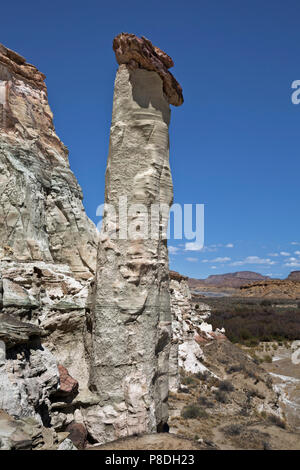 UTAH - Boulder perched on an eroded base rock marks the entrance to the Wahweap Hoodoos areas of the Grand Staircase Escalante National Monument. Stock Photo