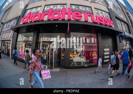 People walk by the newly opened Charlotte Russe stoe in Herald Square in New York n Monday, July 2, 2018. The chain, which appeals to a younger demographic, was recently listed as at risk due to the migration away from brick and mortar mall-based stores. (© Richard B. Levine) Stock Photo