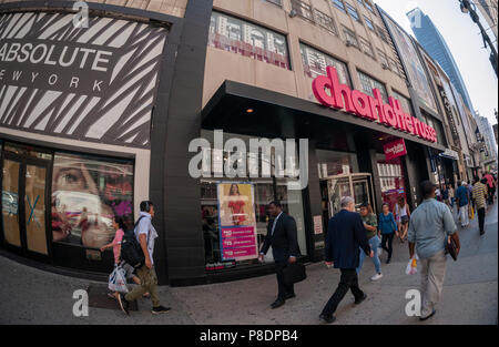 People walk by the newly opened Charlotte Russe stoe in Herald Square in New York n Monday, July 2, 2018. The chain, which appeals to a younger demographic, was recently listed as at risk due to the migration away from brick and mortar mall-based stores. (Â© Richard B. Levine) Stock Photo
