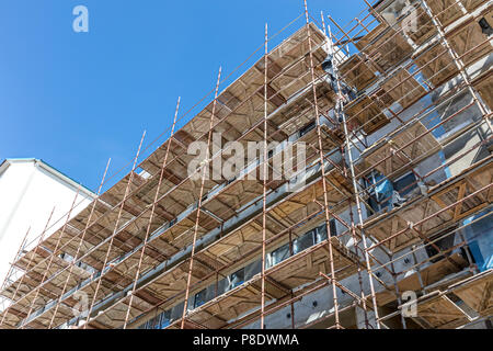 old building under reconstruction. thermal insulation of building facade. Stock Photo