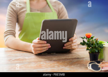 close up of female gardener with tablet pc Stock Photo