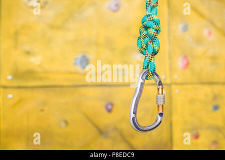 Rope on the background of Grips of climbing wall, Rock climbing  Stock Photo