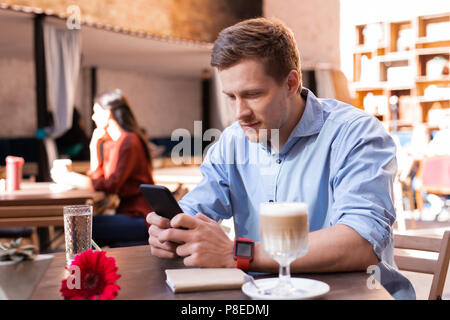 Modern businessman checking his e-mail on smart phone Stock Photo