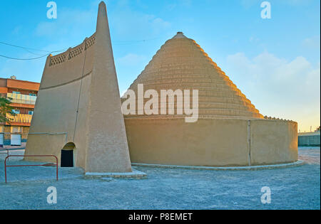 The medieval evaporative cooler, named yakhchal, located in old town of Kerman, adobe construction has the shape of the spiral dome, Iran. Stock Photo