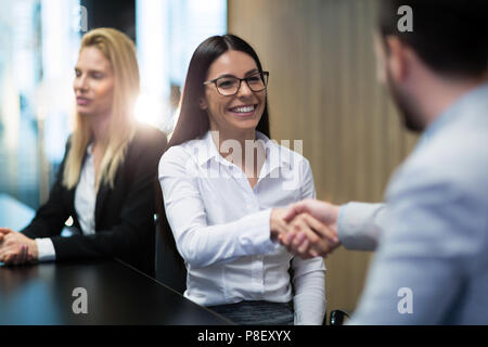 Portrait of business couple in conference room Stock Photo