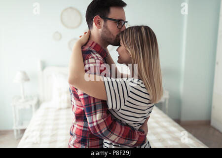 Young couple having romantic time in bedroom Stock Photo
