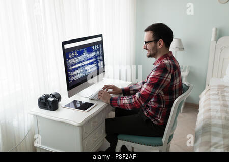Young designer working on project from home Stock Photo