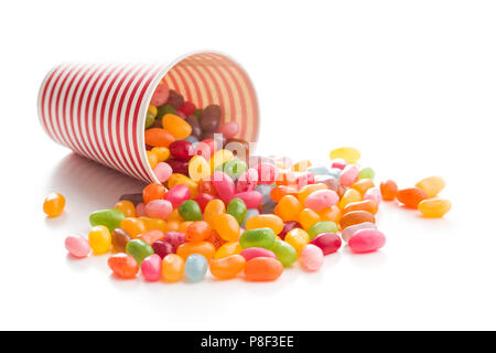 Sweet jelly beans in paper cup isolated on white background. Stock Photo