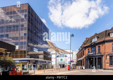 Hawker Hunter aircraft mounted on a pole outside the Big Apple entertainment centre in Crown Square, Woking town centre, Surrey, UK Stock Photo