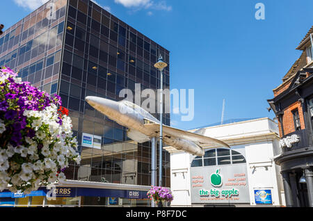 Hawker Hunter aircraft mounted on a pole outside the Big Apple entertainment centre in Crown Square, Woking town centre, Surrey, UK Stock Photo