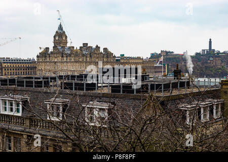 Edinburgh, United Kingdom - January 13, 2018: Construction cranes over the skyline of Edinburgh in Scotland. Stock Photo