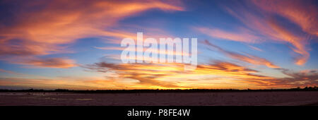 Panorama of Autumn sunset over dry saqlt lake near Mildura, Victoria, Australia. Stock Photo