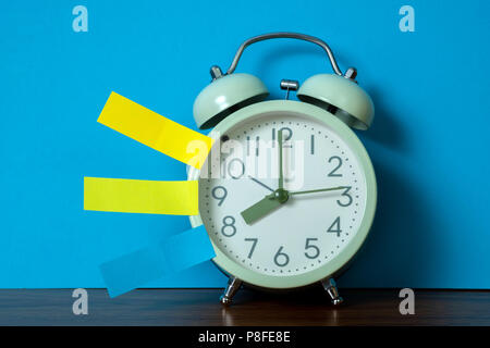 Note paper sticky and vintage alarm clock on table with copy space for add text notice something, list memo and schedule concept idea. Stock Photo