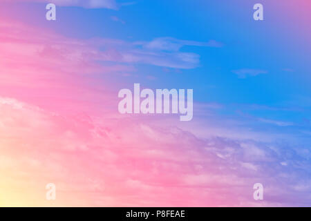 Sweet pastel colored cloud and sky with sun light, soft cloudy with gradient pastel color background. summer concept. Stock Photo