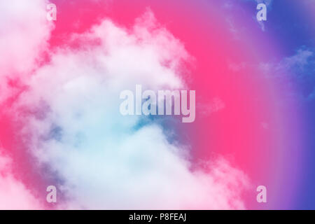 Sweet pastel colored cloud and sky with sun light, soft cloudy with gradient pastel color background. summer concept. Stock Photo