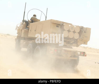 SOUTHWEST ASIA – A High Mobility Artillery Rocket System from Bravo Battery, 1st Battalion, 14th Field Artillery Regiment, 65th Field Artillery Brigade, Task Force Spartan, moves to its firing position after reloading during the Golden Sparrow exercise on June 29, 2018. (U.S. Army photo by Staff Sgt. Matthew Keeler) Stock Photo