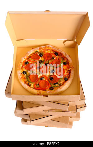 Pizza on a stack of delivery boxes isolated on a white background, top view Stock Photo