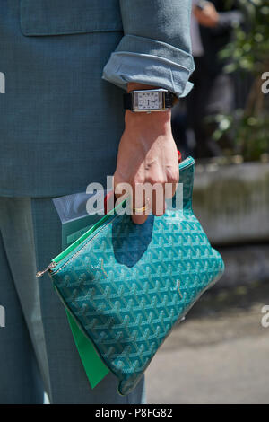 MILAN - JUNE 16: Man with green Goyard bag Jaeger Le coultre Reverso watch  before Marni fashion show, Milan Fashion Week street style on June 16, 2018  Stock Photo - Alamy