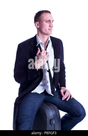 Young  business man in crises late to the train, studio shot Stock Photo
