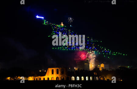 Beautiful fireworks in Gubbio with giant christmas tree at new year's eve Stock Photo