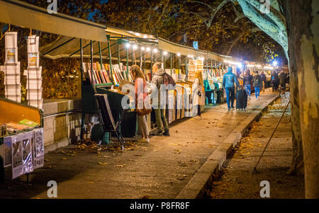 Small shops on the river Tiber near Umberto I Bridge in a winter evening, Rome, Italy. Stock Photo