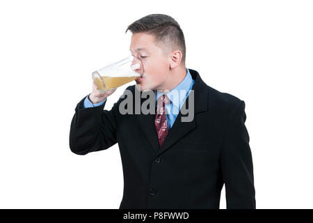 Businessman drinking beer from mug Stock Photo