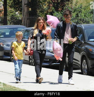 Pregnant Hilary Duff attends a school event with boyfriend Matthew Koma ...