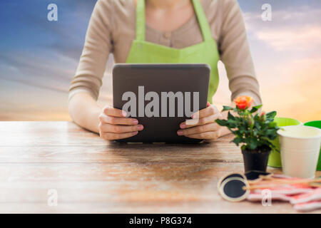 close up of female gardener with tablet pc Stock Photo