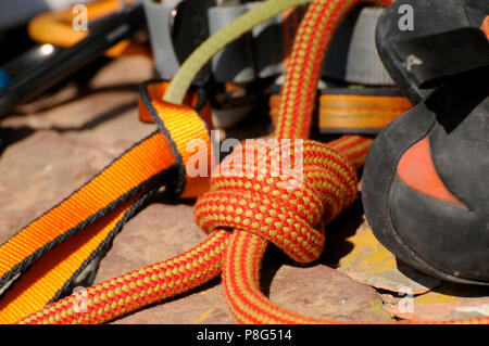 Climbing Equipment, rock climbing, mountaineering, climbing harness, webbing, figure-eight knot, climber's shoes Stock Photo