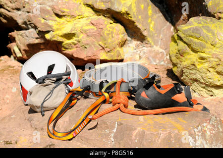 Climbing Equipment, rock climbing, climbing harness, webbing, figure-eight knot, helmet, climber's shoes Stock Photo
