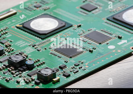 Close up photo of circuit board on wooden background Stock Photo